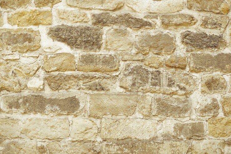 Beige Steinmosaikwandhintergrund