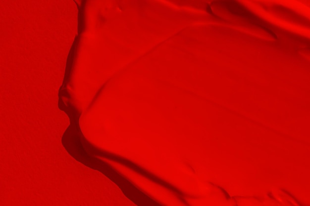 Bela textura de uma rica cor vermelha brilhante Cor escarlate Textura de batom sombra tinta líquida mancha vermelha mancha fosca