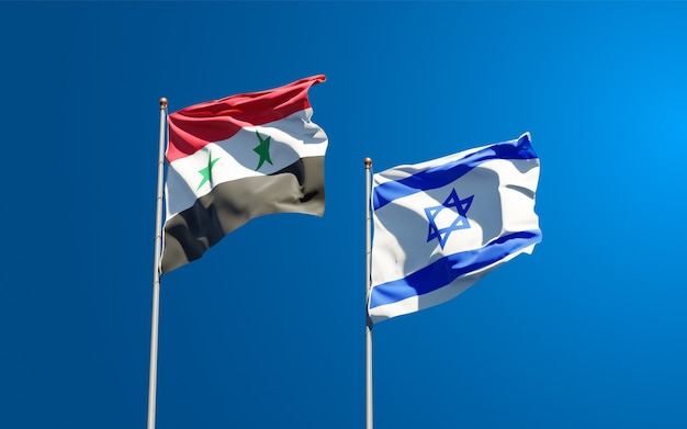 Belas bandeiras do estado nacional de Israel e Síria juntos ao fundo do céu.