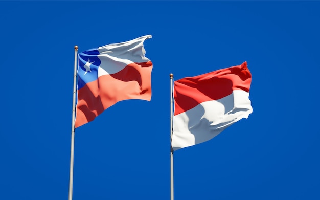 Belas bandeiras estaduais da Indonésia e do Chile juntas no céu azul