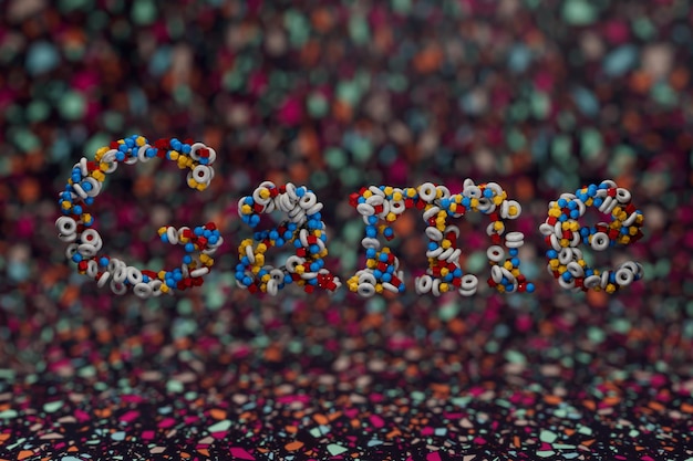 belo jogo de inscrição multicolorido composto por padrões de pequenas esferas, cubos, tori