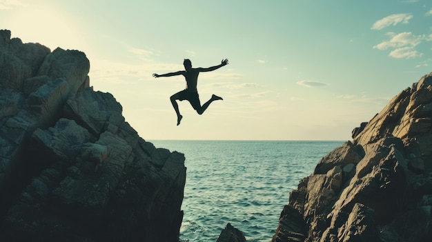 Überwindung von Hindernissen Silhouette eines Mannes, der über einen Felsen springt, ein Abgrund, der Freiheit und Erfolg symbolisiert