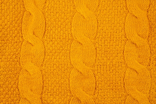 Beschaffenheit der orange woolen gestrickten Strickjacke