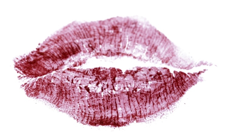 Foto beso de lápiz labial aislado en blanco