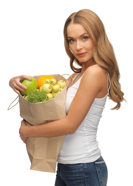 Foto bild von frau mit einkaufstüte voller früchte