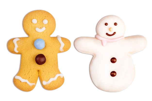 Biscoitos de natal de boneco de gengibre e boneco de neve em branco