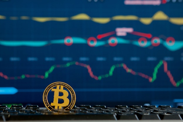 Bitcoin-Goldmünze und defokussiertes Diagramm