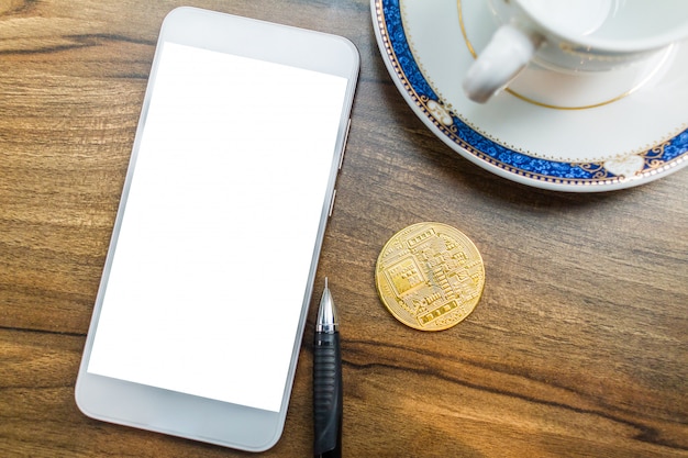 Bitcoin-Münze auf Smartphone