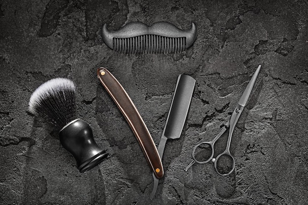 Foto black barber tools peluquería brocha de afeitar maquinilla de afeitar recta tijeras peine símbolo