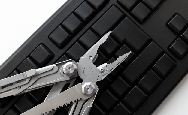 Black Blank Keyboard with Multi Tool with Pliers on it