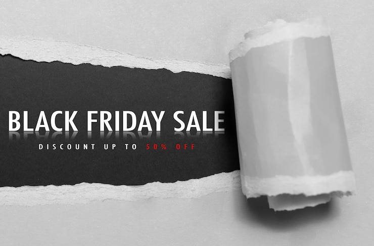 Foto black friday sale konzepttext auf zerrissenem papier loch grau detailansicht