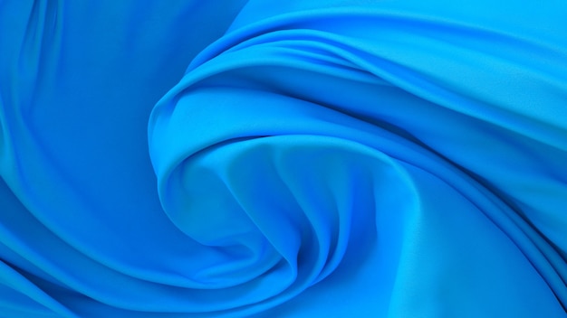 Blau gefärbtes Stoffstück Stoffhintergrund