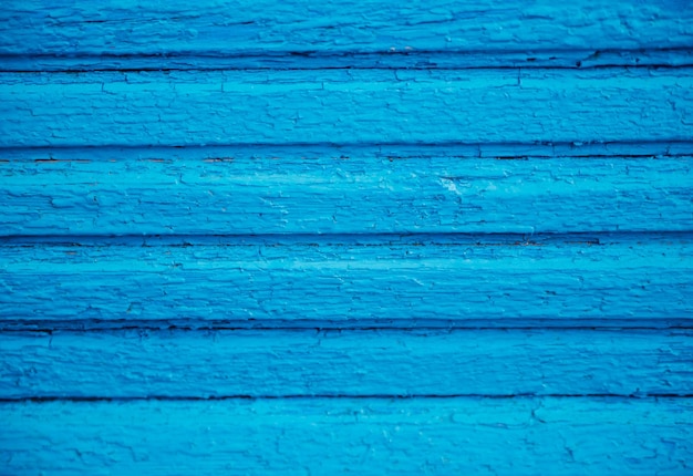 Blau lackierte Holzbretter Raue und rissige Oberfläche Altes Holz und FarbeHintergrund und Textur