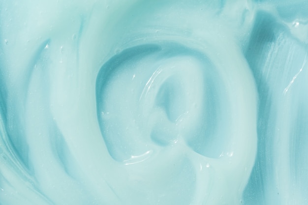 Blaue Creme Feuchtigkeitscreme Shampoo verteilen Sonnenschutz kosmetischer Abstrich Hintergrund feuchtigkeitsspendende Schönheitscreme
