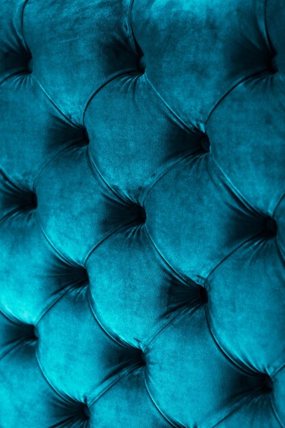 Foto blaue luxus-velours-steppsofapolsterung mit knöpfen, elegante wohnkultur-textur und hintergrund