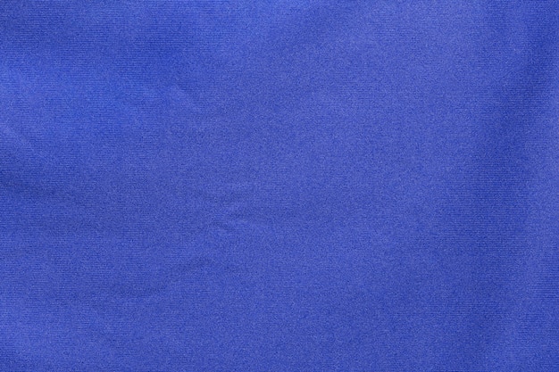 Blaue Sportbekleidungsstoff-Fußballtrikot-Jersey-Textur und textiler Hintergrund