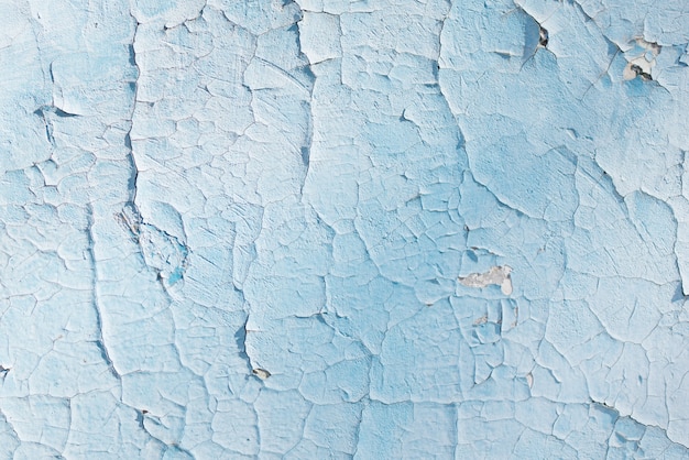 Blaue Textur mit Kratzern und Rissen. Blauer Hintergrund. blaues und weißes Muster