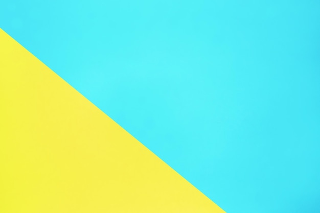 Blaue und gelbe pastellfarbene Papierstruktur Draufsicht minimaler flacher Hintergrund