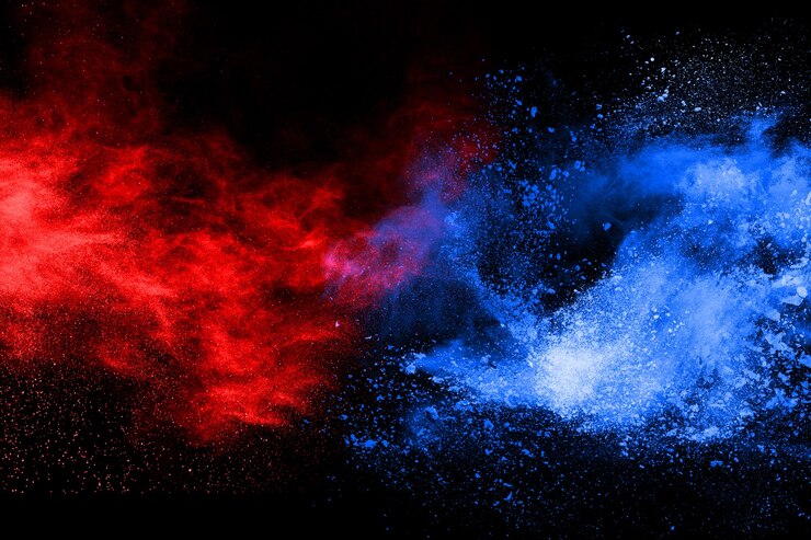 blaue und rote Pulverexplosion auf schwarzem Hintergrund