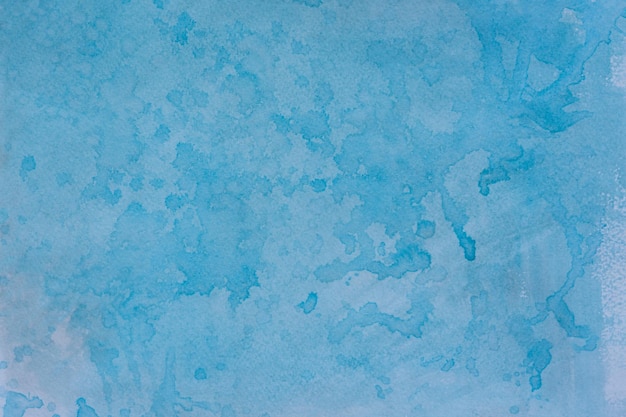 Blauer Aquarellhintergrund mit Tropfen Handgefertigt mit einem Pinsel bespritzt Schöne Originalstreifen