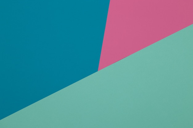 Blauer, grüner und rosa Hintergrund, farbiges Papier unterteilt sich geometrisch in Zonen, Rahmen, Kopie, Raum.