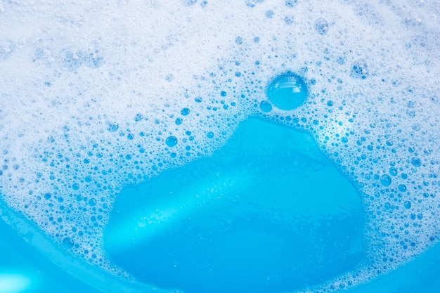 Blauer Hintergrund der Waschmittelschaumblase