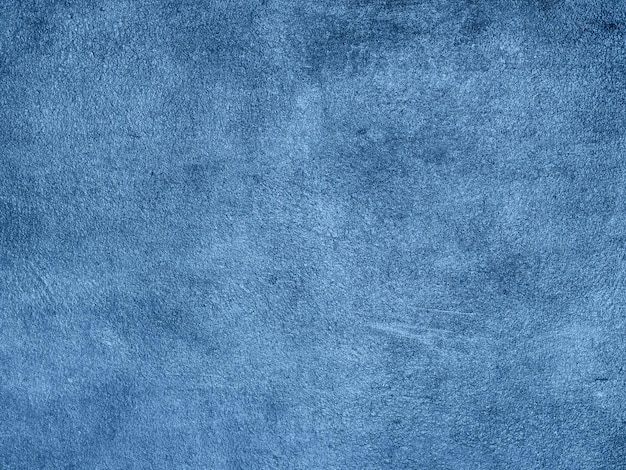 Blauer Hintergrund. Grunge-Textur-Putz auf einer Betonwand.