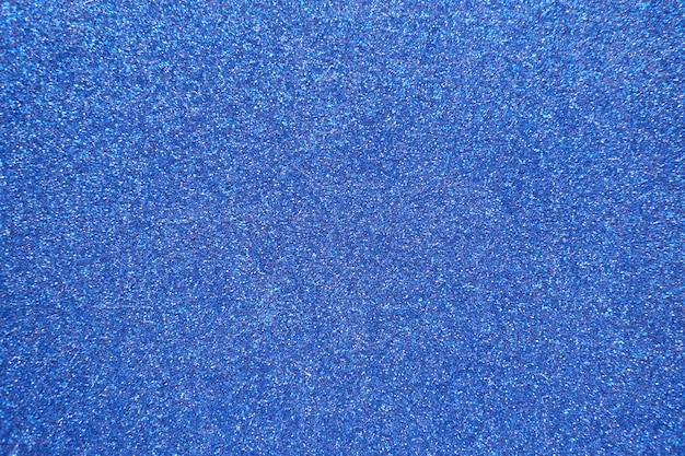 Foto blauer hintergrund mit abstraktem hintergrund der glitzerbeschaffenheit