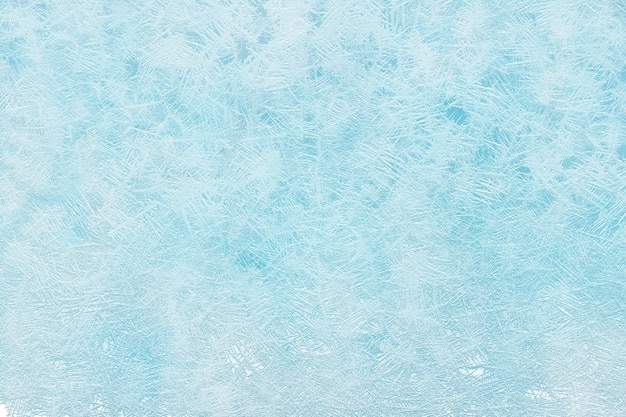 Blauer Winter-Hintergrund mit Frostverzierung
