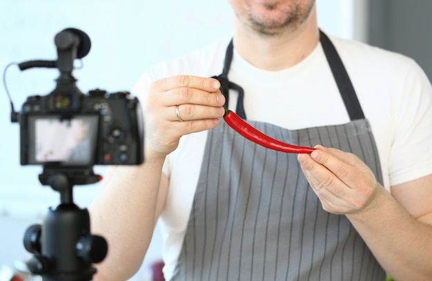 Blogger Man Recording Red Chili Pepper Recipe