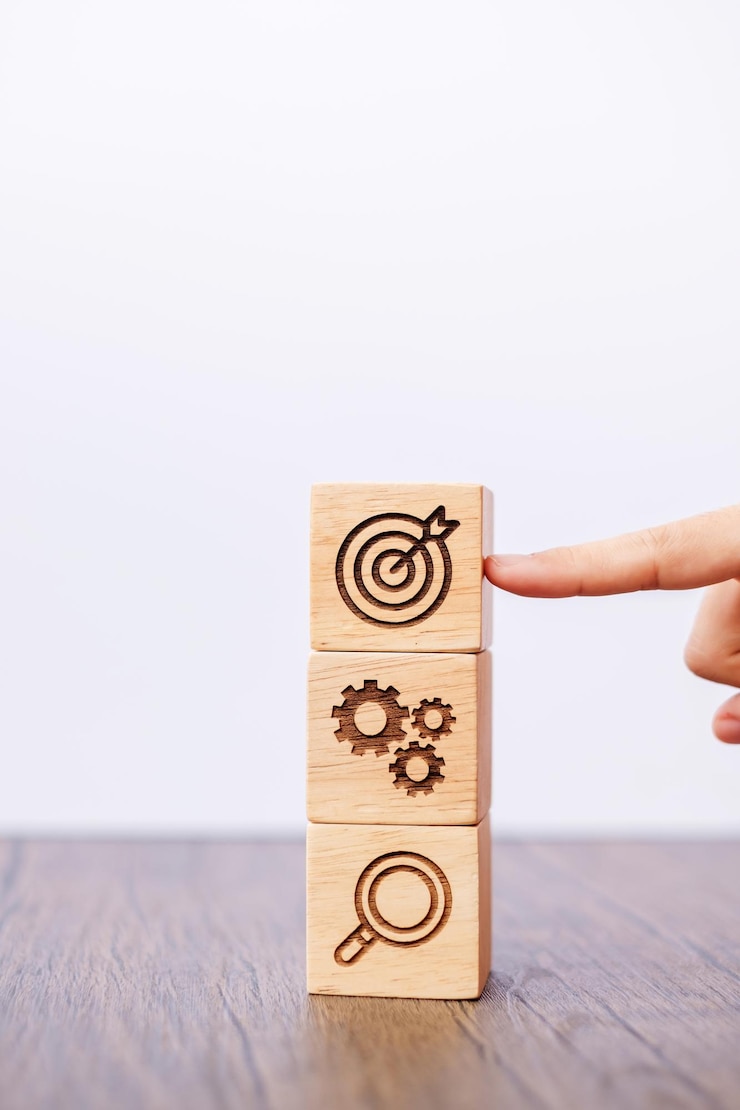 Foto bloque de madera con objetivo de negocio estrategia objetivo misión acción objetivo trabajo en equipo lluvia de ideas y concepto de idea
