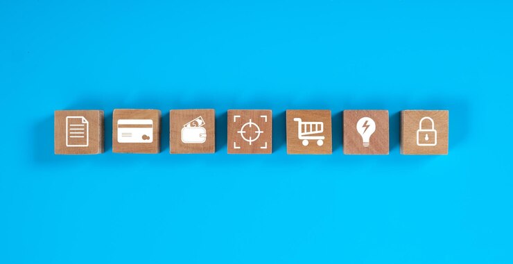 Foto bloques de madera cuadrados sobre fondo azul con concepto de icono de finanzas.