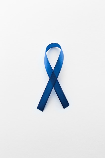 Foto blue cancer ribbon on white background