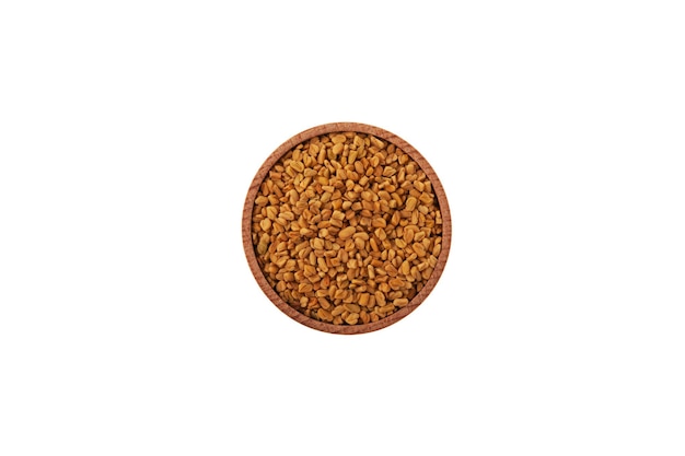 Bockshornkleesamen MethiDana in Holzschale Shambhala oder Helba-Samen ist ein traditionelles indisches Gewürz