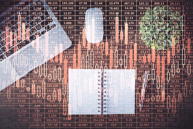 Foto börsendiagramm und draufsicht-computer auf dem tischhintergrund doppelbelichtung konzept der finanzbildung