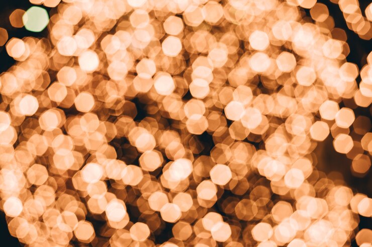 Foto bokeh abstracto oro enciende el fondo. desenfocado