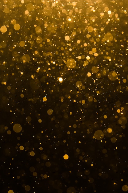 Bokeh abstracto de oro con fondo negro