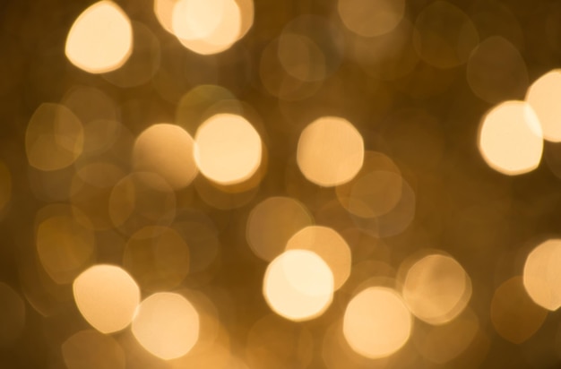 Bokeh abstrato espumante com fundo dourado e círculos brilhantes sem pessoas