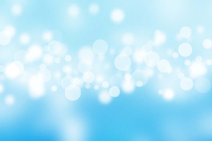 Bokeh brilhante abstrato no fundo desfocado do céu azul.