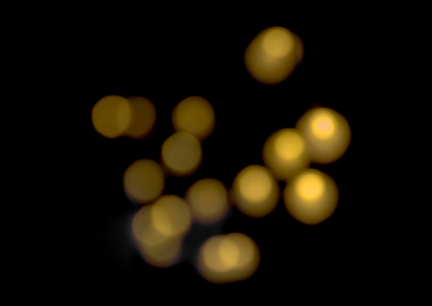 El bokeh de color dorado sobre fondo negro