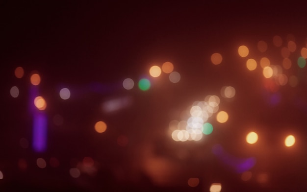 Bokeh de luzes multicoloridas da cidade à noite. desfoque do plano de fundo da cidade.