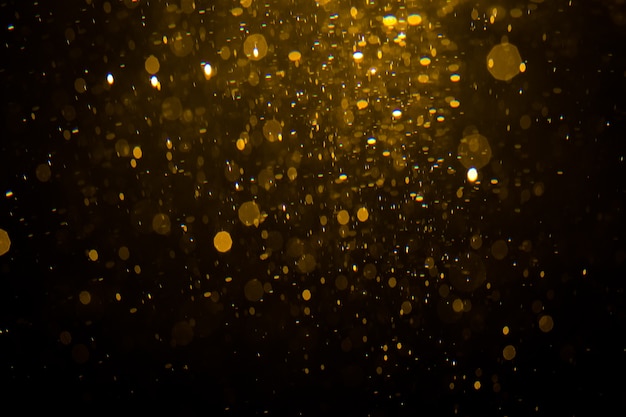 Bokeh de ouro abstrata com fundo preto