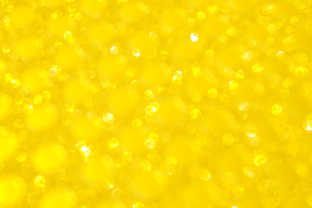 Bokeh desenfocado luces. Fondo abstracto de oro amarillo brillante o textura