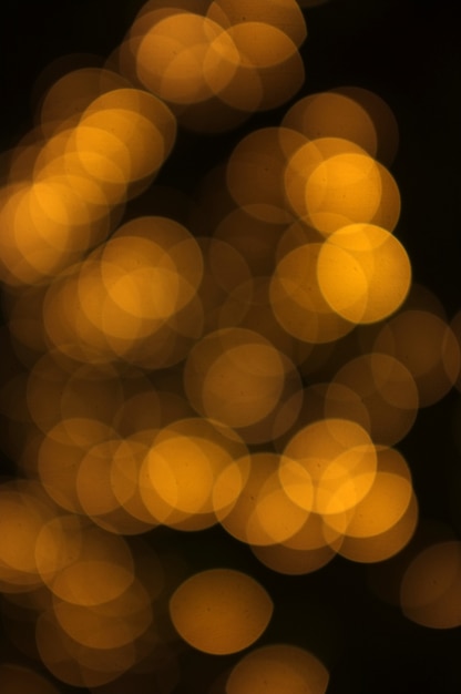 Bokeh dorado luz abstracta, fondo naranja