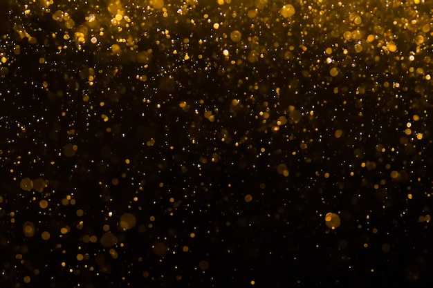 Bokeh dourado abstrato com preto