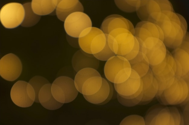 Bokeh dourado luz abstrata, fundo laranja