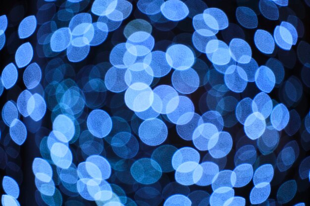 Bokeh de fondo brillante abstracto de la quema de bombillas de luz azul