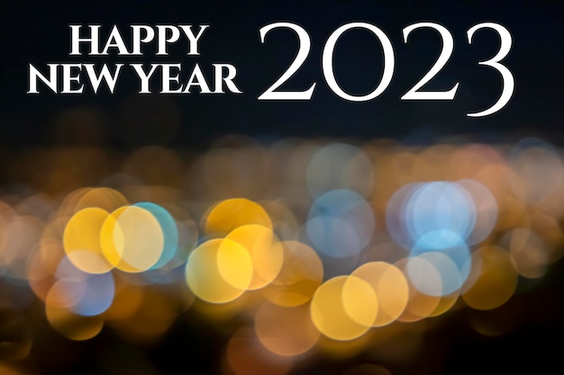 Bokeh frohes neues Jahr 2023 mit verschwommenem Hintergrund mit Vintage-Lichtern