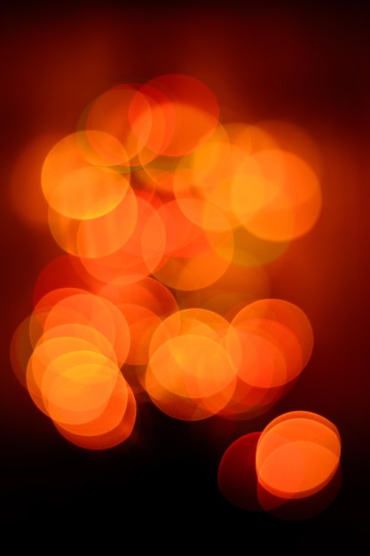 Bokeh in den Rot- und Orangetönen der Neujahrsstimmung verschwommenen Hintergrund