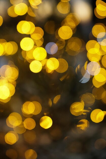 Bokeh de luz dorada para el fondo de luces de vacaciones o el fondo de Navidad